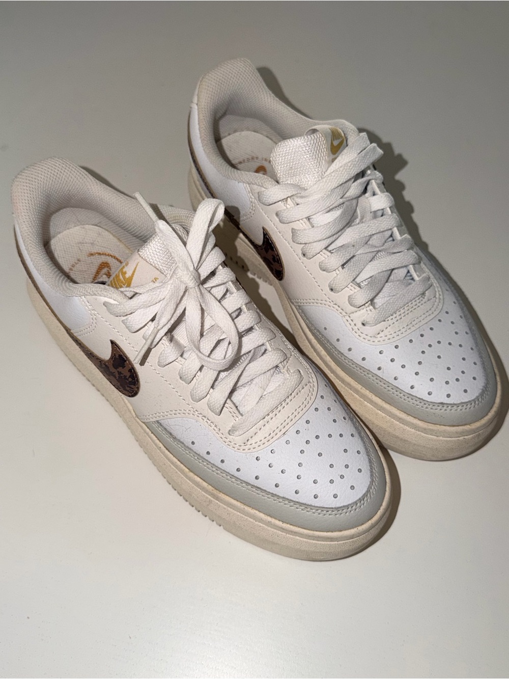 Nike Women’s White Low-Top Sneakers with Brown Leopard Swoosh